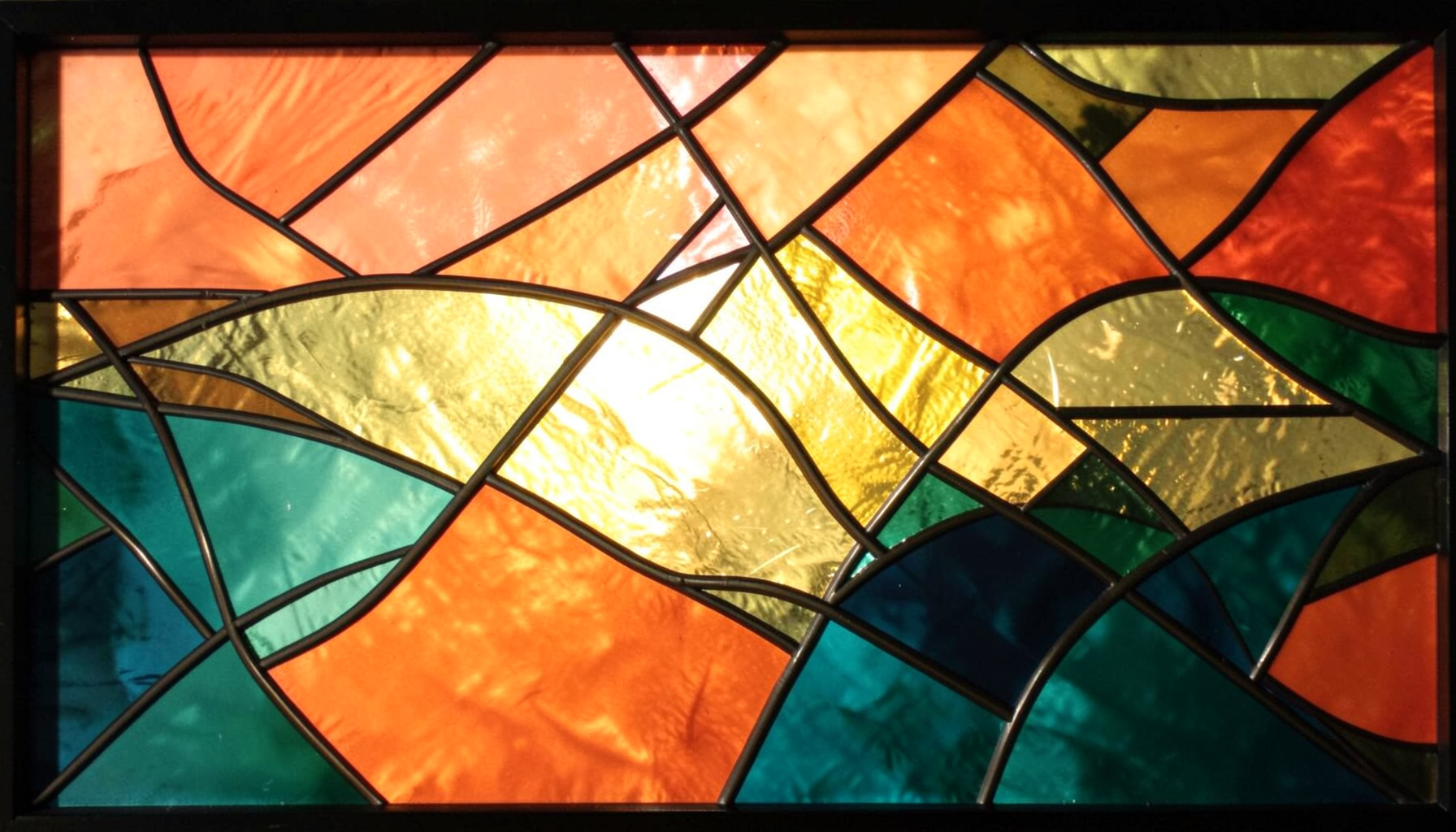 A stained-glass composition with bold leaded segments in warm coral, gold, and teal, depicting layered overlapping shapes that evoke clarity emerging from complexity